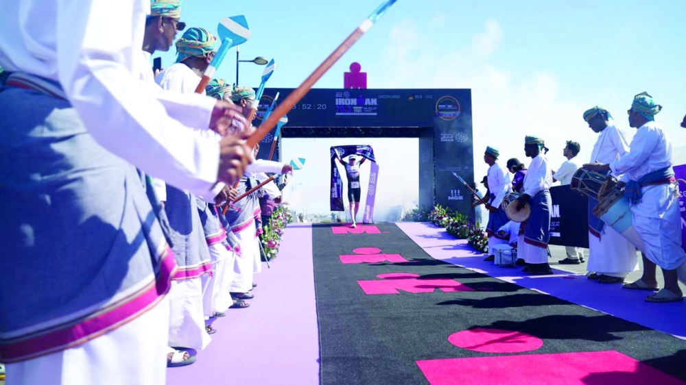 An athlete crosses the finish line.