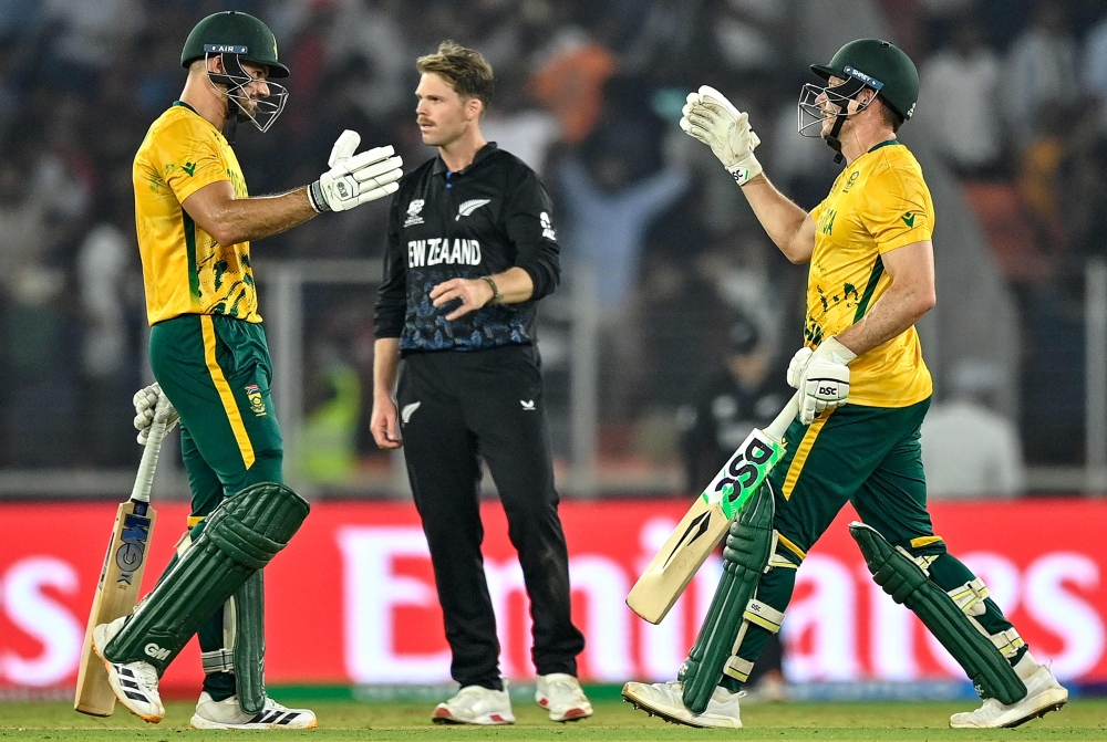 South Africa's captain Aiden Markram (L) and David Miller (R)  