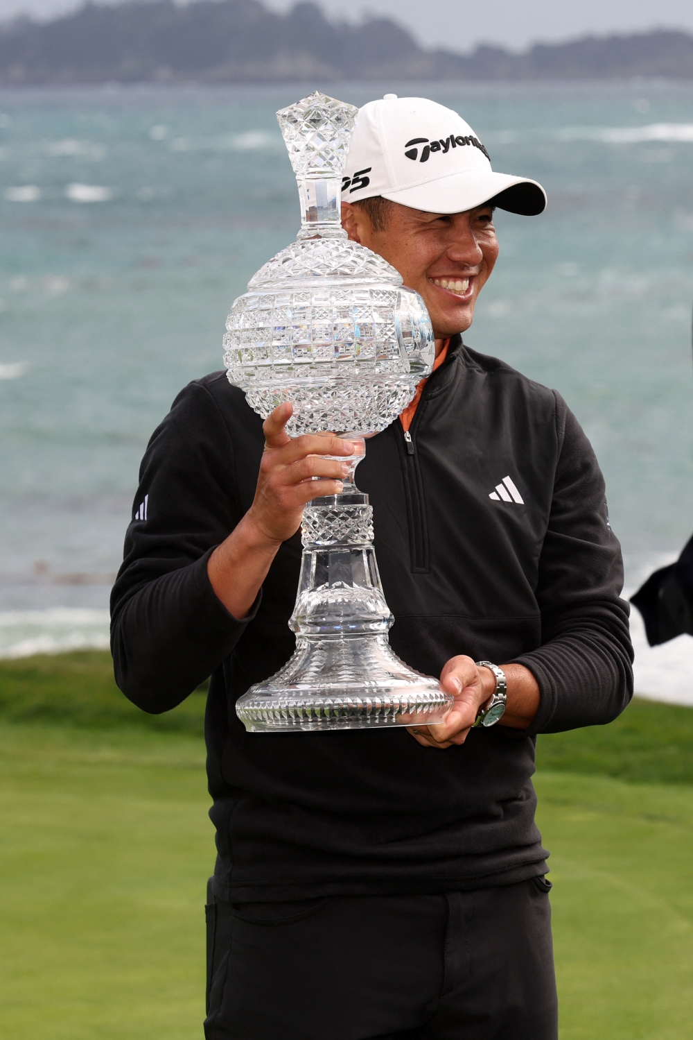  Collin Morikawa holds the trophy after winning the AT&T Pebble Beach Pro-Am