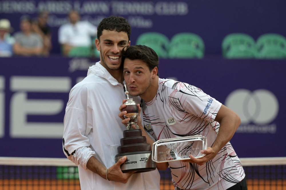 Francisco Cerundolo (L), the winner,  Luciano Darderi pose with their trophies  