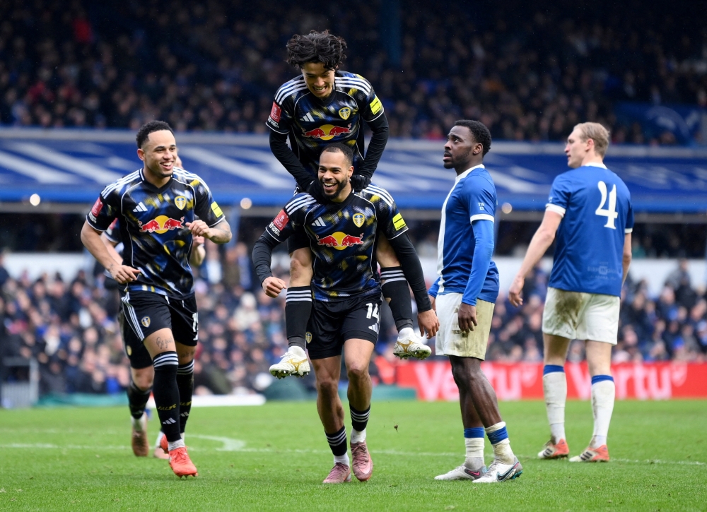   Leeds United's Lukas Nmecha celebrates scoring their first goal with teammates  