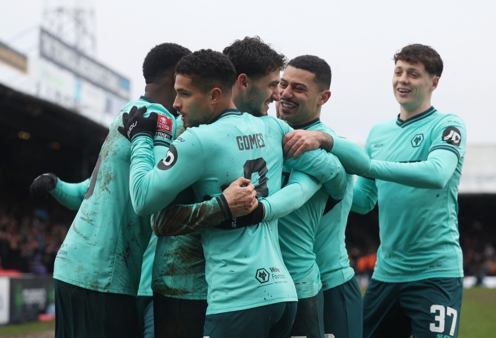  Wolverhampton Wanderers' Santiago Bueno celebrates scoring their first goal with teammates  