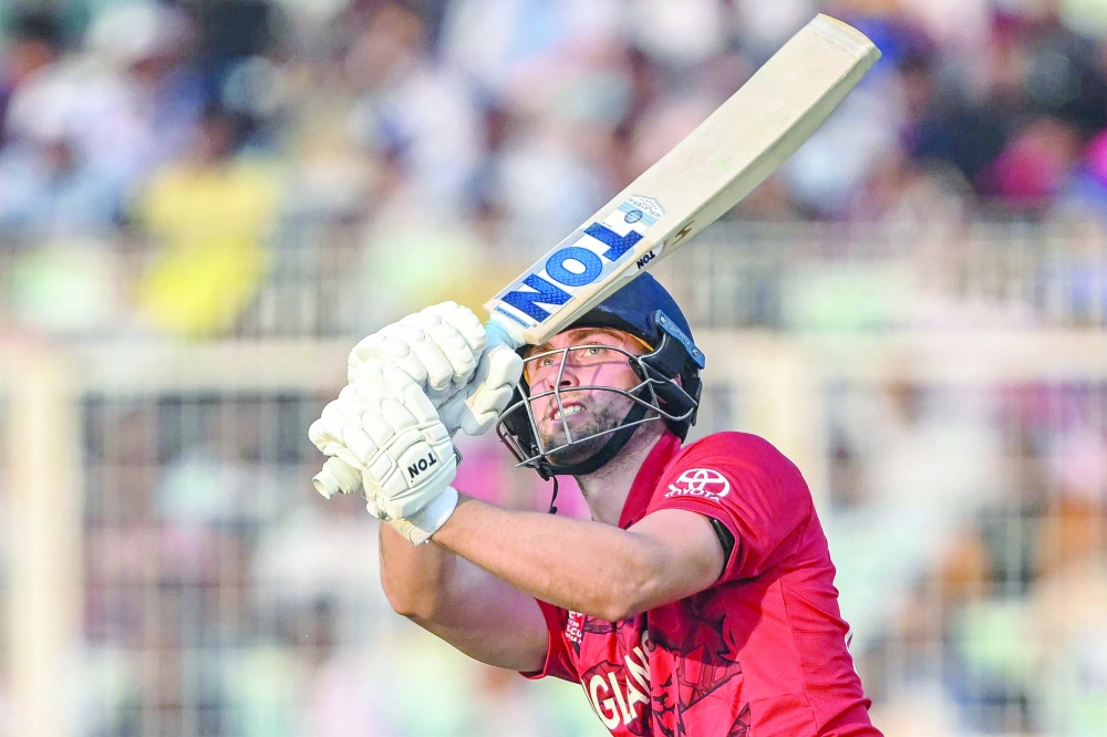 England's Will Jacks watches the ball after playing a shot during the 2026 ICC Men's T20 Cricket World Cup group stage match between England and Italy at the Eden Gardens in Kolkata on February 16, 2026.  (Photo by Dibyangshu SARKAR / AFP)
