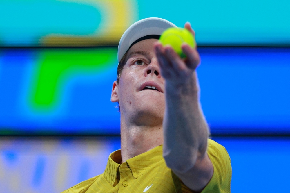 Italy's Jannik Sinner serves a ball against Czech Republic's Tomas Machac 
