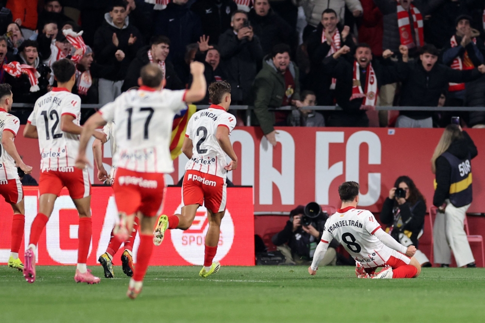 Girona's Spanish midfielder #08 Fran Beltran celebrates scoring his team's second goal  