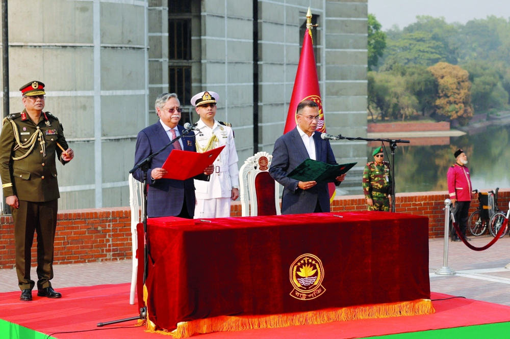 Bangladeshi President Mohammed Shahabuddin (L) administers oath-taking ceremony of Tarique Rahman (R) as the country’s Prime Minister, in Dhaka. — Reuters