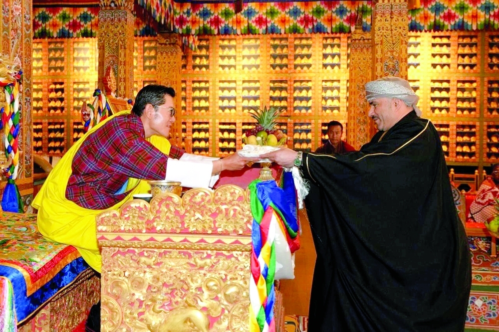 King Jigme Khesar Namgyel Wangchuck of the Kingdom of Bhutan receives Issa bin Saleh al Shibani.