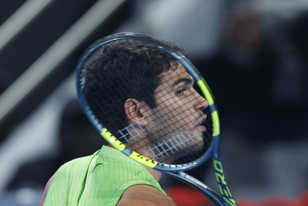 Spain's Carlos Alcaraz reacts during their match against France's Arthur Rinderknech  