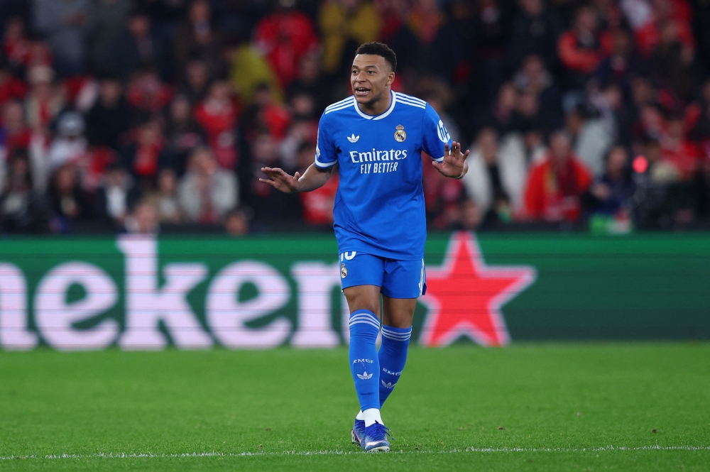   Real Madrid's Kylian Mbappe reacts as the match was stopped due to racist chants  