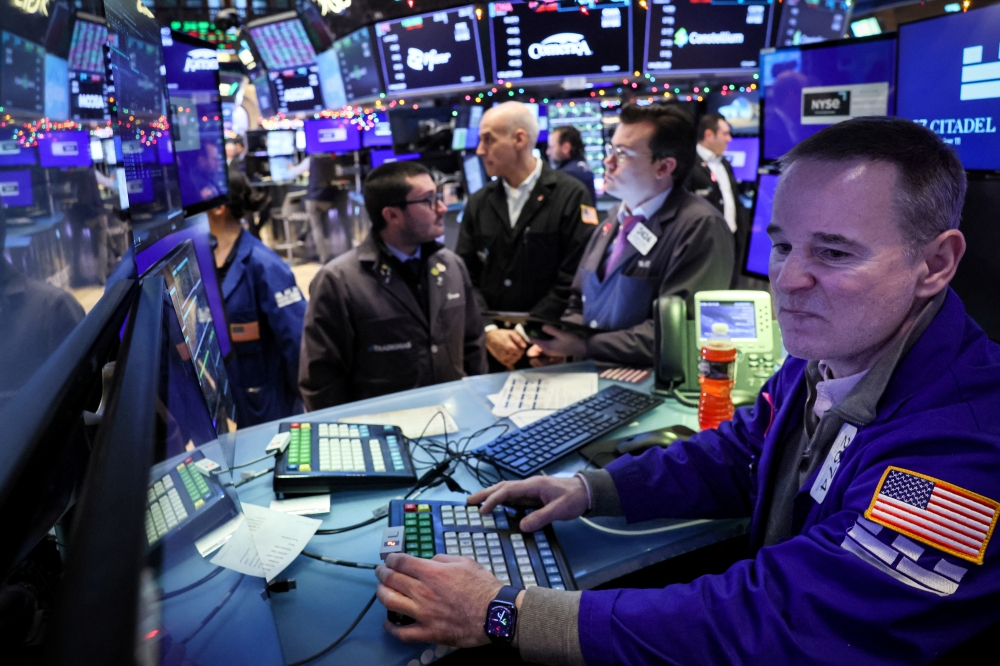 Traders work on the floor at the New York Stock Exchange (NYSE) in New York City. — Reuters