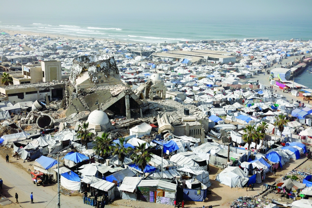 A mosque, destroyed during the two-year Israeli offensives, is surrounded by tents for displaced Palestinians