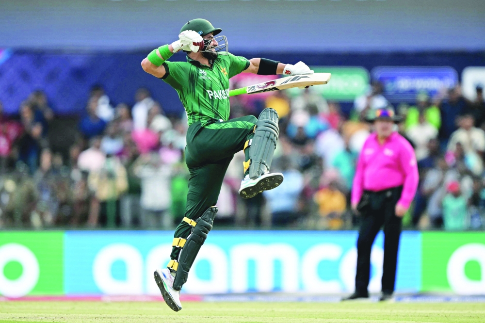 Pakistan's Sahibzada Farhan celebrates after scoring a century (100 runs) during the 2026 ICC Men's T20 Cricket World Cup group stage match between Pakistan and Namibia