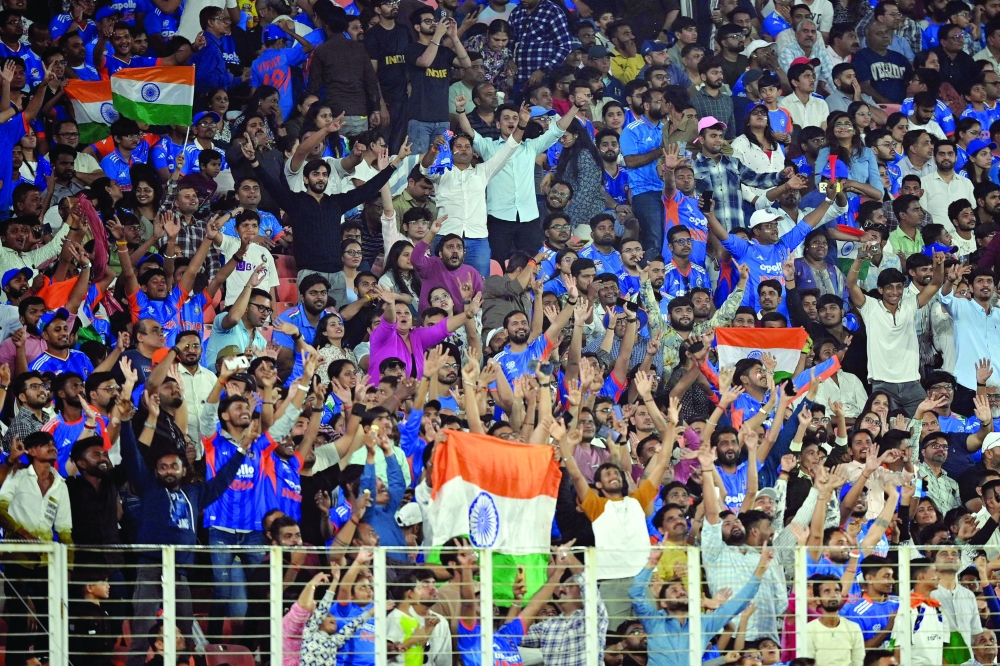 India's fans cheer after their win in the 2026 ICC Men's T20 Cricket World Cup group stage match against Netherlands at the Narendra Modi Stadium in Ahmedabad 