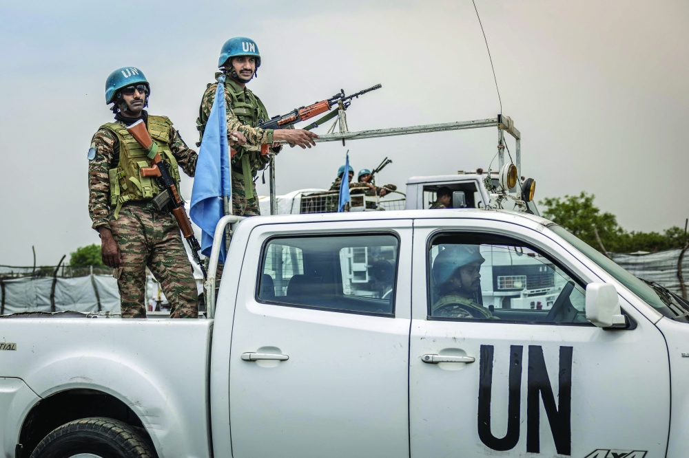 
Indian peacekeepers serving with the United Nations Mission in South Sudan patrol near an airstrip in the strategic opposition-controlled town of Akobo, Jonglei State. — AFP 