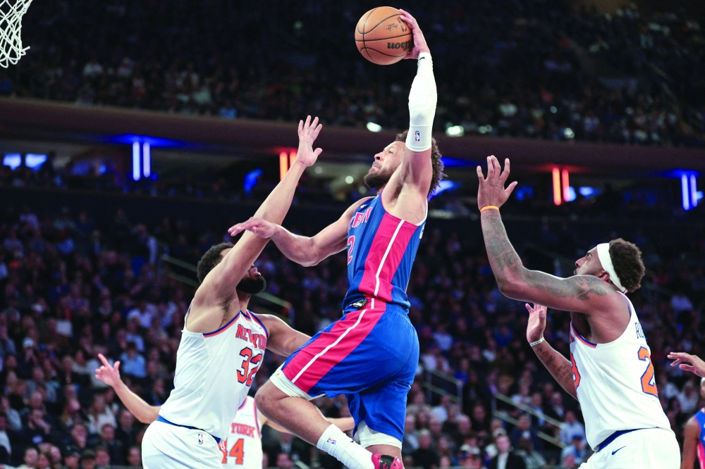 Detroit Pistons' Cade Cunningham (2) goes up for a dunk against New York Knicks' Karl-Anthony Towns (32) at Madison Square Garden. — Imagn Images