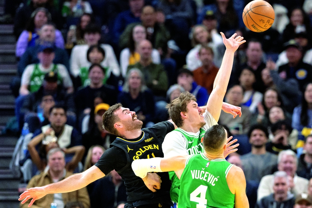 Boston Celtics' Baylor Scheierman (55) puts up a shot ahead of Golden State Warriors' Pat Spencer (61) at Chase Center. — Imagn Images