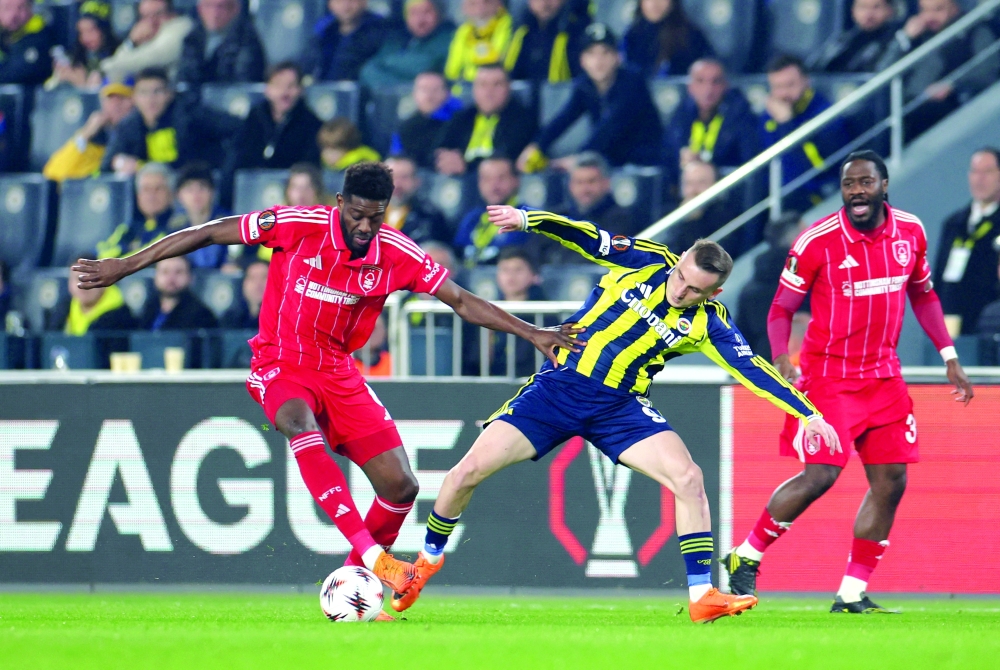 Soccer Football - UEFA Europa League - Play Off - First Leg - Fenerbahce v Nottingham Forest - Sukru Saracoglu Stadium, Istanbul, Turkey - February 19, 2026 Nottingham Forest's Ibrahim Sangare in action with Fenerbahce's Kerem Akturkoglu REUTERS/Murad Sezer