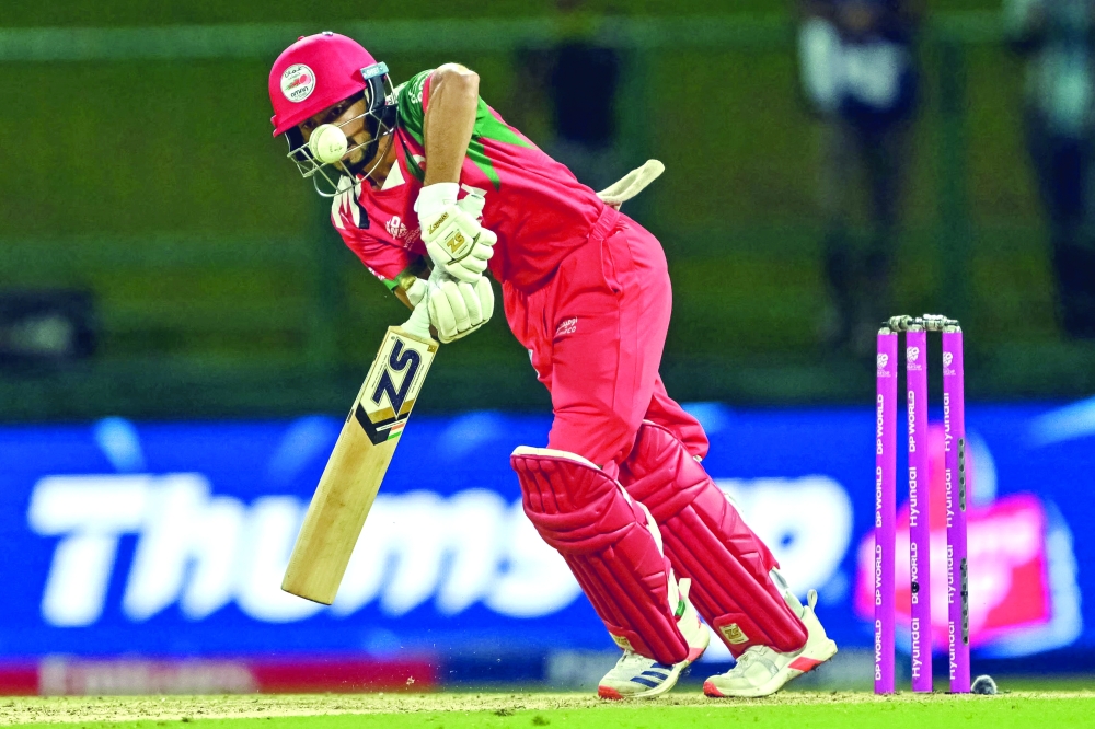 Oman's Hammad Mirza plays a shot during the 2026 ICC Men's T20 Cricket World Cup group stage match between Oman and Australia at Pallekele International Cricket Stadium in Kandy on February 20, 2026.  (Photo by Ishara S. KODIKARA / AFP)
