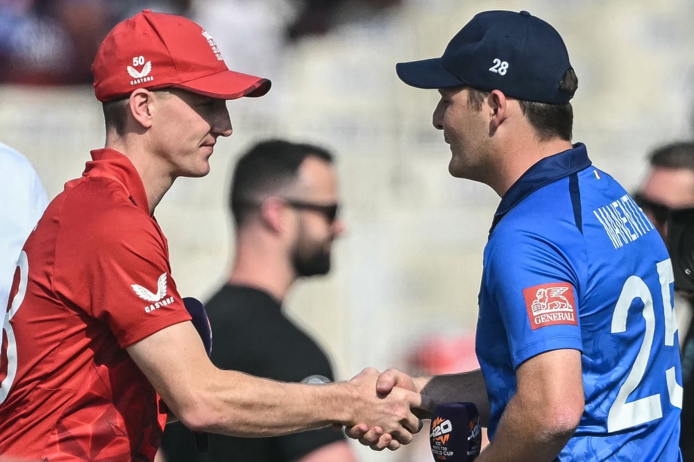 England's captain Harry Brook (L) shakes hands with Italy's captain Harry Manenti 