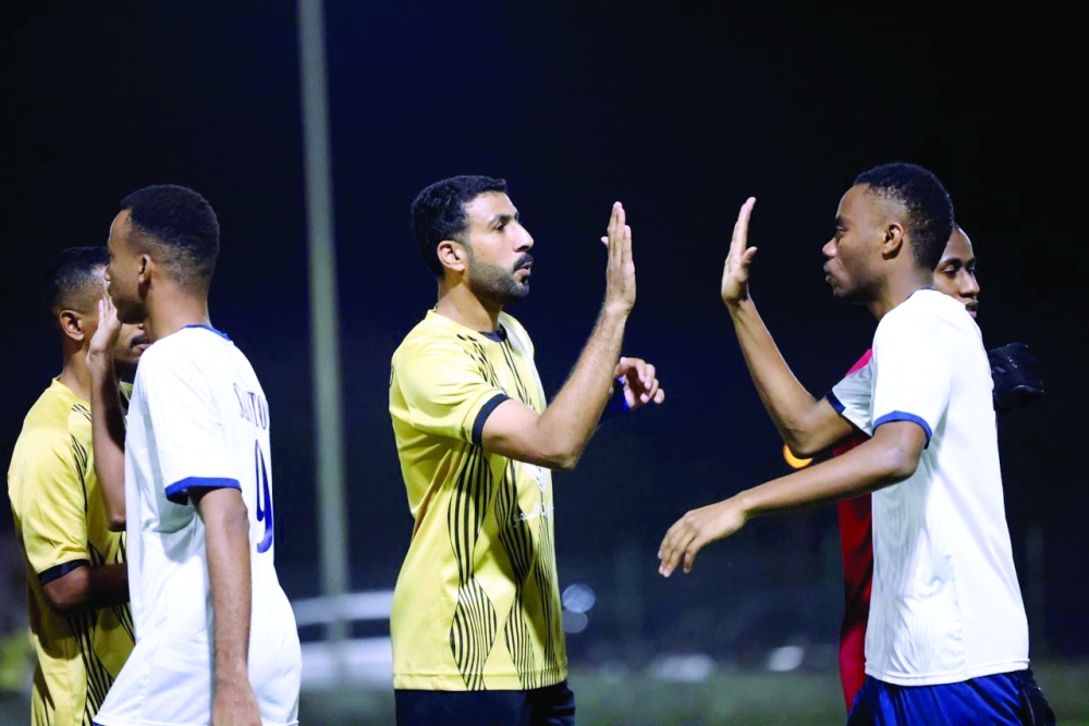 The players shook hands to demonstrate sportsmanship between the two teams.