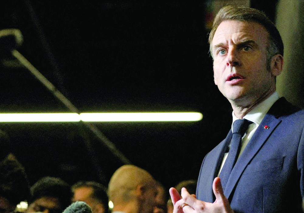 France's President Emmanuel Macron speaks to the press, in Paris. — AFP