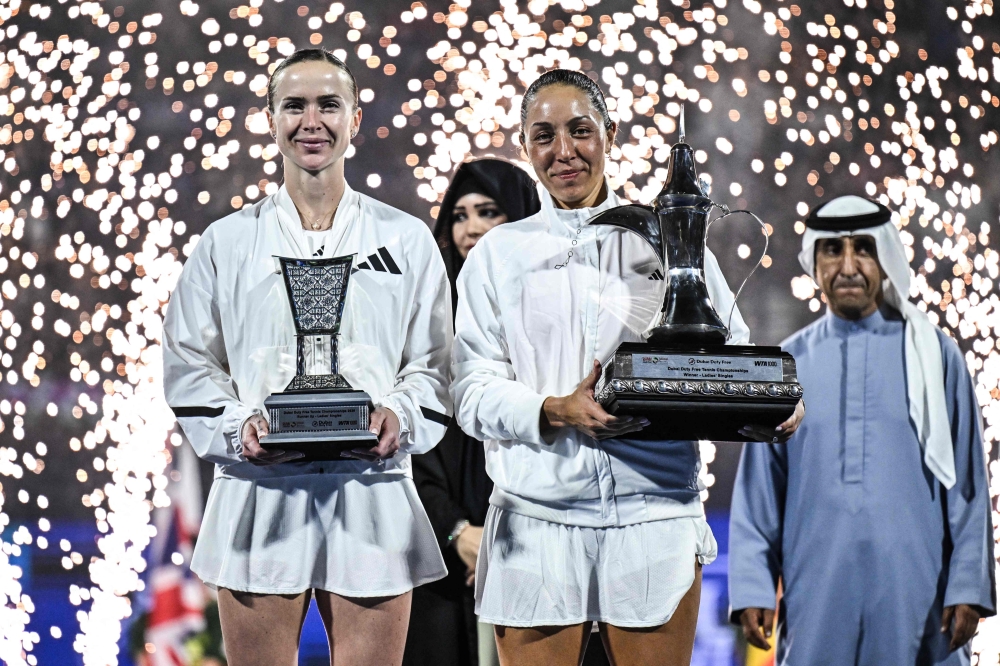 US' Jessica Pegula (C-R) and Ukraine's Elina Svitolina pose with their trophies  