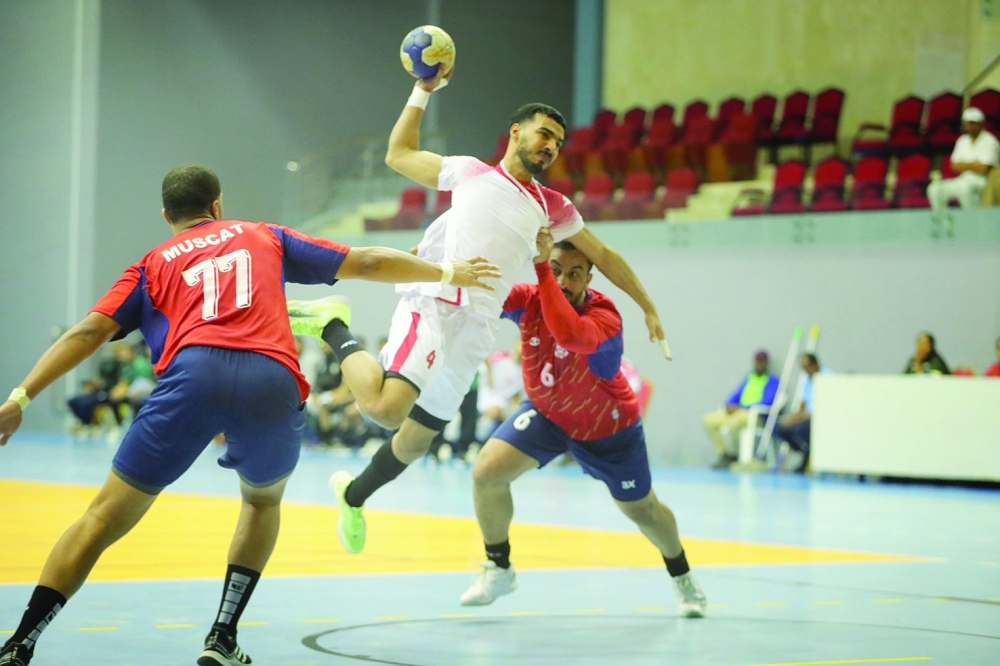 Oman Club player in an attempt to score a goal.