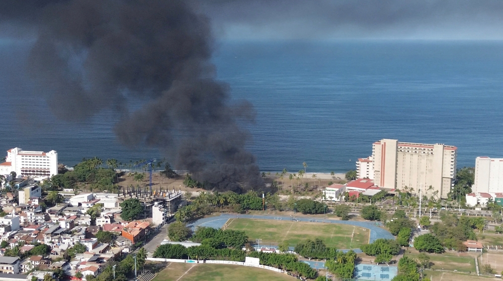 Smoke billows, following a military operation in which a government source said Mexican drug lord Nemesio Oseguera, known as "El Mencho," was killed, in Puerto Vallarta