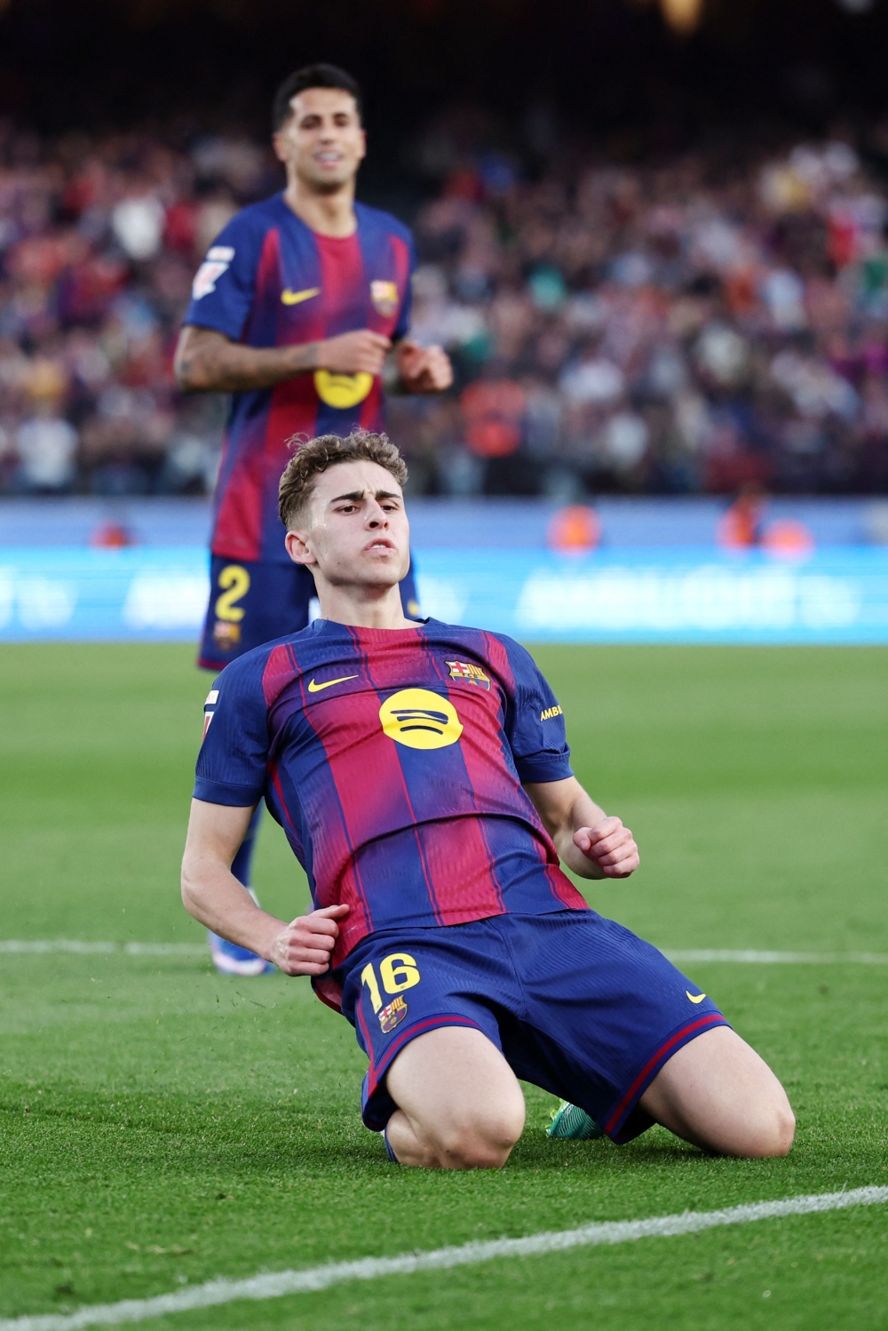 Barcelona's Spanish midfielder #16 Fermin Lopez celebrates scoring his team's third goal  
