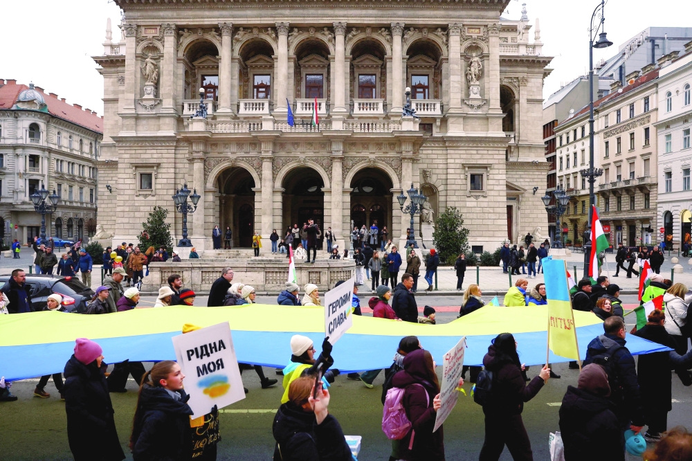 People take part in a solidarity march ahead of the fourth anniversary of Ukraine war, in Budapest, Hungary. — Reuters
