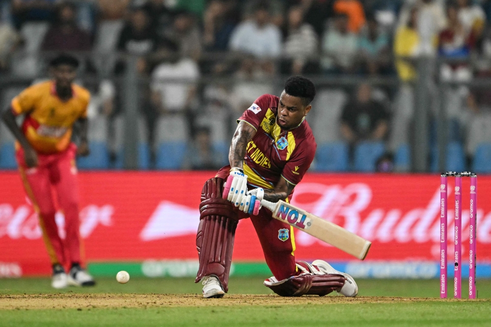 West Indies' Shimron Hetmyer plays a shot during the 2026 ICC Men's T20 Cricket World Cup Super Eights match between West Indies and Zimbabwe at the Wankhede Stadium in Mumbai on February 23, 2026.  (Photo by Indranil MUKHERJEE / AFP)

