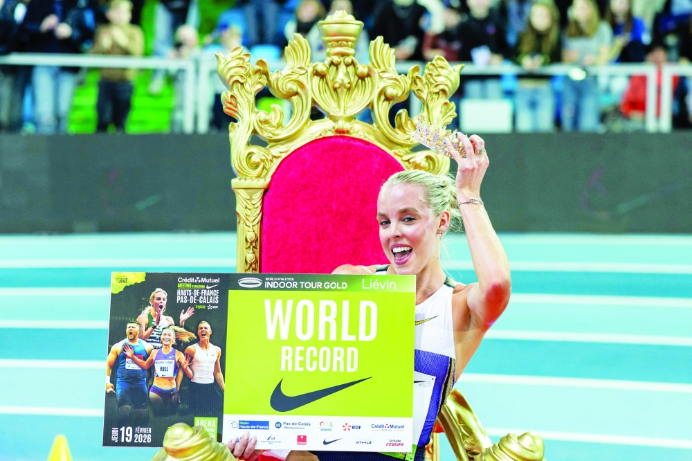 Britain's Keely Hodgkinson celebrates after breaking the world record in the 800m women final at the Athletics meeting 'Hauts-de-France Pas-de-Calais' as part of the World Indoor Tour Gold, in Lievin, northern France on February 19. — AFP
