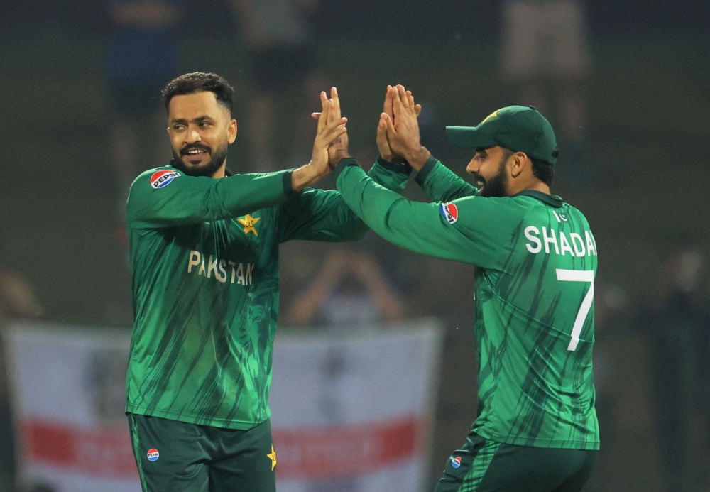   Pakistan's Mohammad Nawaz celebrates with Usman Khan 