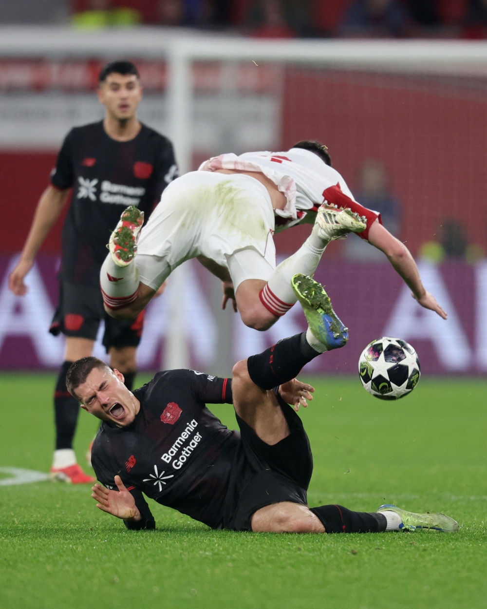   Bayer Leverkusen's Patrik Schick in action with Olympiacos' Lorenzo Pirola  