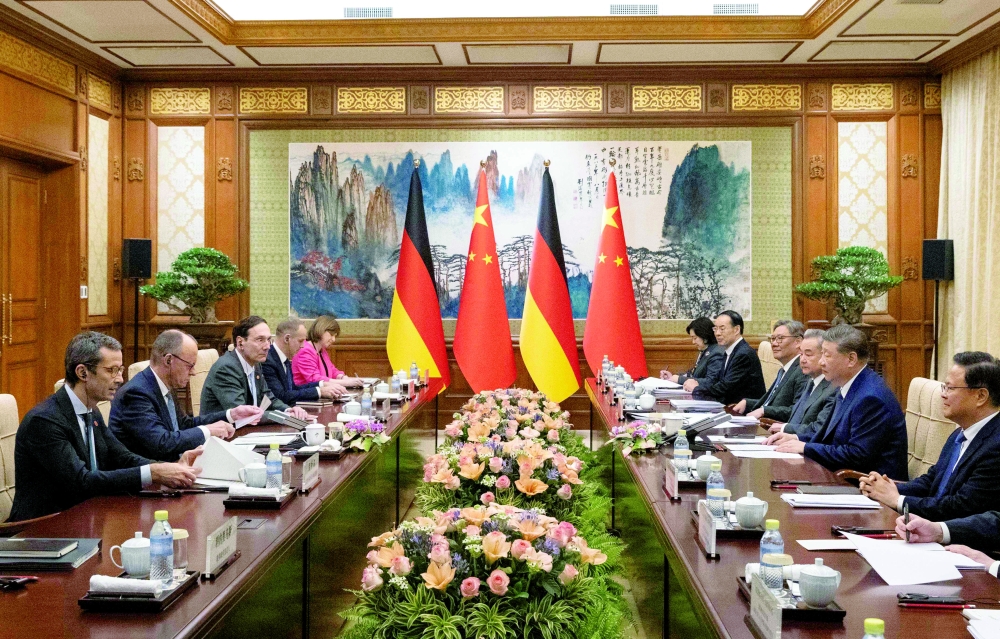 German Chancellor Friedrich Merz (2nd L) participates in a meeting with Chinese President Xi Jinping (2nd R) at the Diaoyutai State Guesthouse in Beijing. — AFP