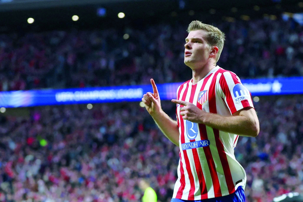 Atletico Madrid's Norwegian forward #09 Alexander Sorloth celebrates scoring his team's third goal during the UEFA Champions League knockout round play-off second leg football match between Club Atletico de Madrid and Club Brugge KV at Metropolitano Stadium in Madrid on February 24, 2026.  (Photo by Pierre-Philippe MARCOU / AFP)
