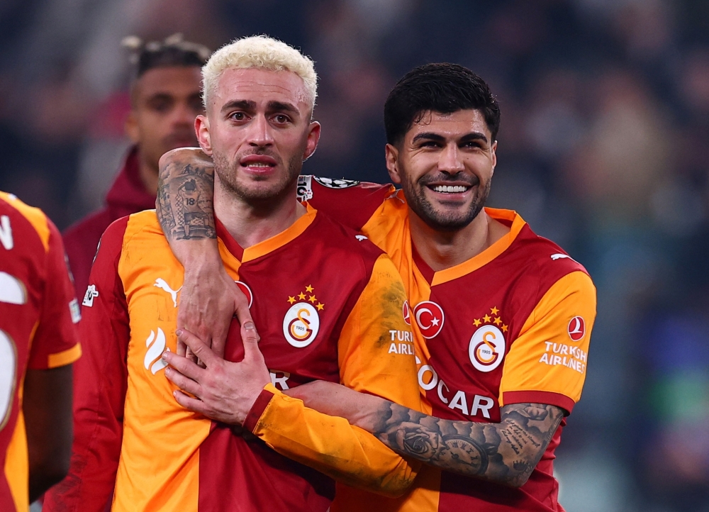 Galatasaray's Baris Alper Yilmaz and Eren Elmali celebrate after the match 