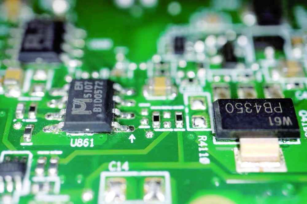 Semiconductor chips are seen on a printed circuit board in this illustration picture. REUTERS