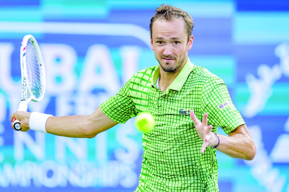 Russia's Daniil Medvedev returns a shot during his men's singles semi-final match against Canada's Felix Auger-Aliassime at the Dubai Duty Free Tennis tournament in Dubai on February 27, 2026. (Photo by Fadel SENNA / AFP)
