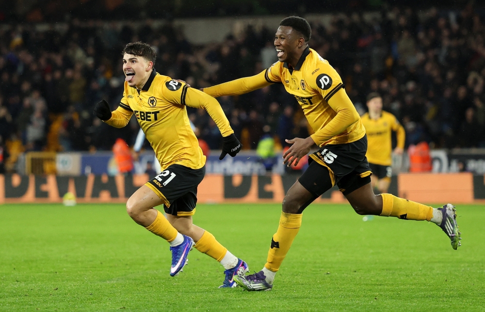 Wolverhampton Wanderers' Rodrigo Gomes celebrates scoring their second goal with Yerson Mosquera 