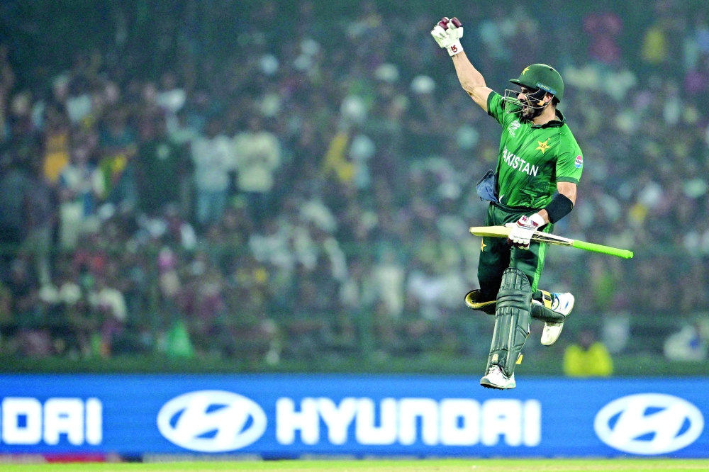 Pakistan's Sahibzada Farhan celebrates after scoring a century (100 runs) during the 2026 ICC Men's T20 Cricket World Cup Super Eights match between Sri Lanka and Pakistan at Pallekele International Cricket Stadium in Kandy on February 28, 2026.  (Photo by R. Satish BABU / AFP)