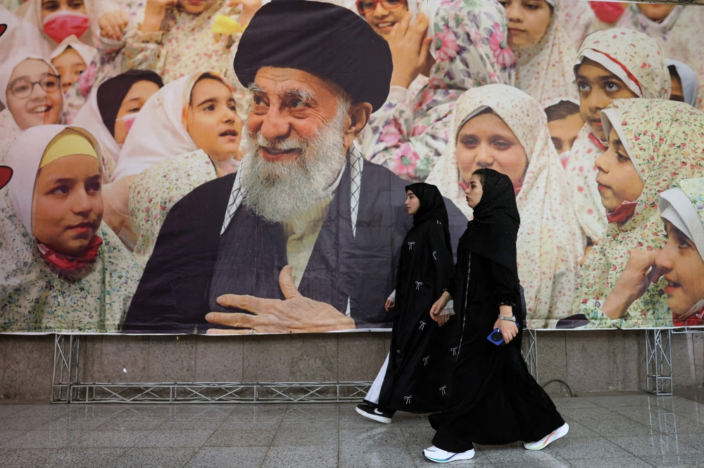 A banner bearing a portrait of Iran's supreme leader Ayatollah Ali Khamenei 