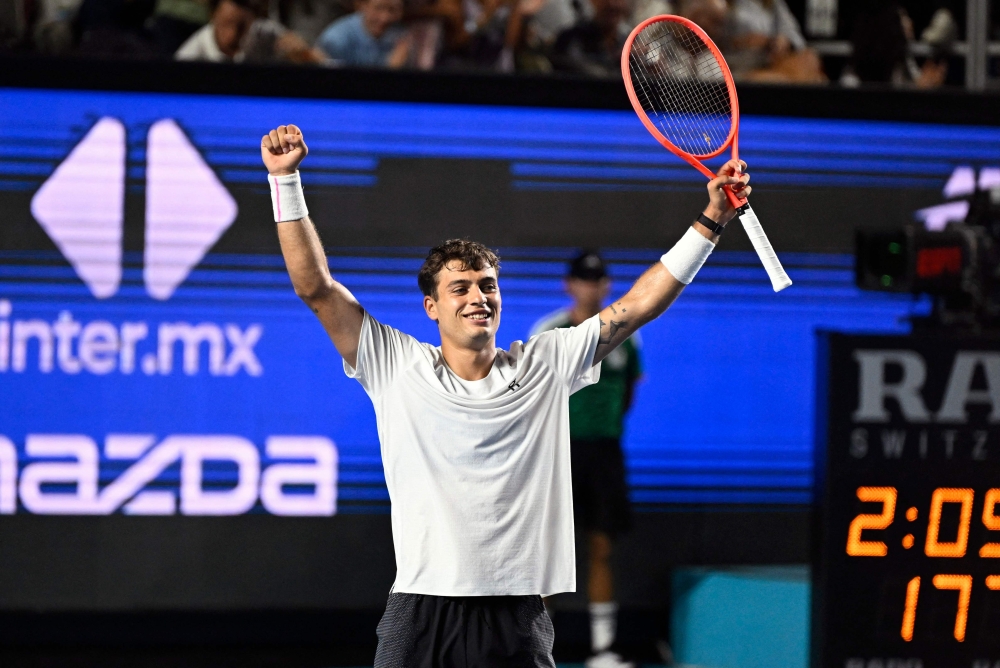 Italy's Flavio Cobolli celebrates his victory against US' Frances Tiafoe during the 2026 Mexico ATP 500 Tennis Open men's singles tennis final match  
