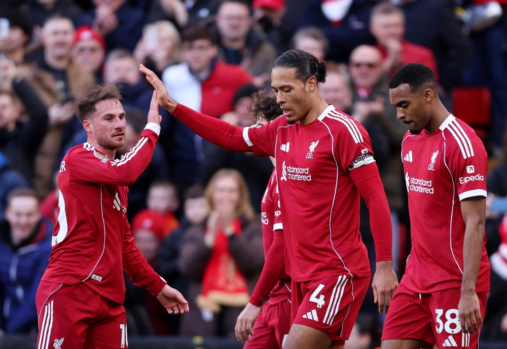   Liverpool's Virgil van Dijk celebrates scoring their second goal with Alexis Mac Allister  