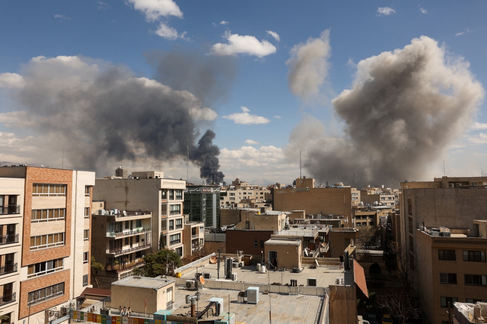 Smoke rises following an explosion, after Israel and the U.S. launched strikes on Iran, in Tehran