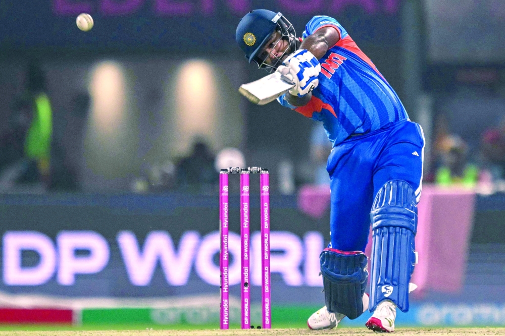 India's Sanju Samson plays a shot during the 2026 ICC Men's T20 Cricket World Cup Super Eights match between India and West Indies at the Eden Gardens in Kolkata on March 1, 2026.  (Photo by Arun SANKAR / AFP)
