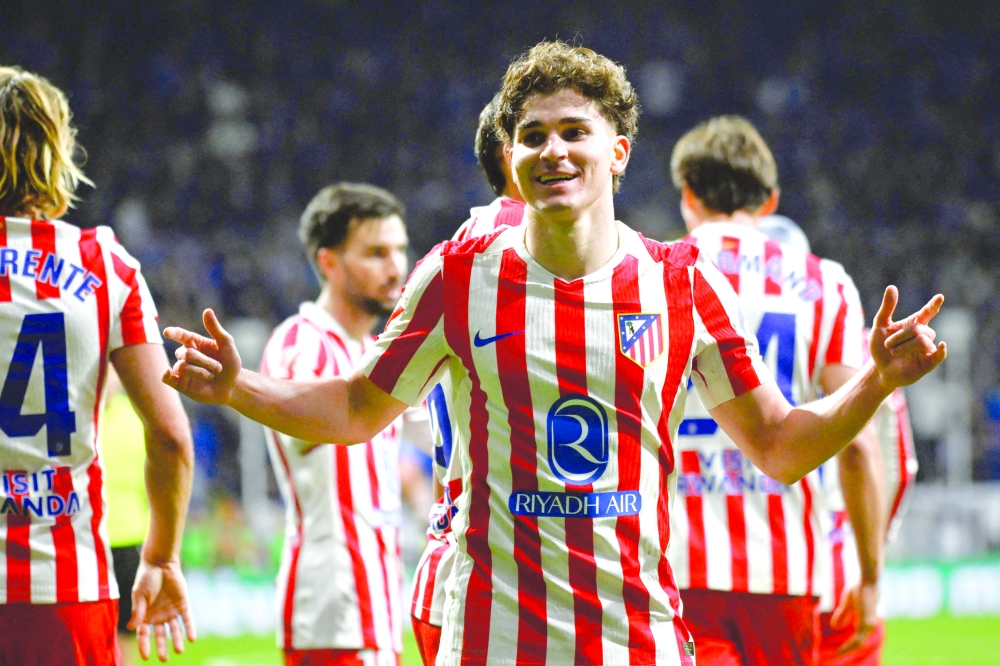 Atletico Madrid's Argentine forward #19 Julian Alvarez celebrates after scoring a goal during the Spanish league football match between Real Oviedo and Club Atletico de Madrid at Carlos Tartiere Stadium in Oviedo on February 28, 2026. (Photo by ANDER GILLENEA   / AFP)
