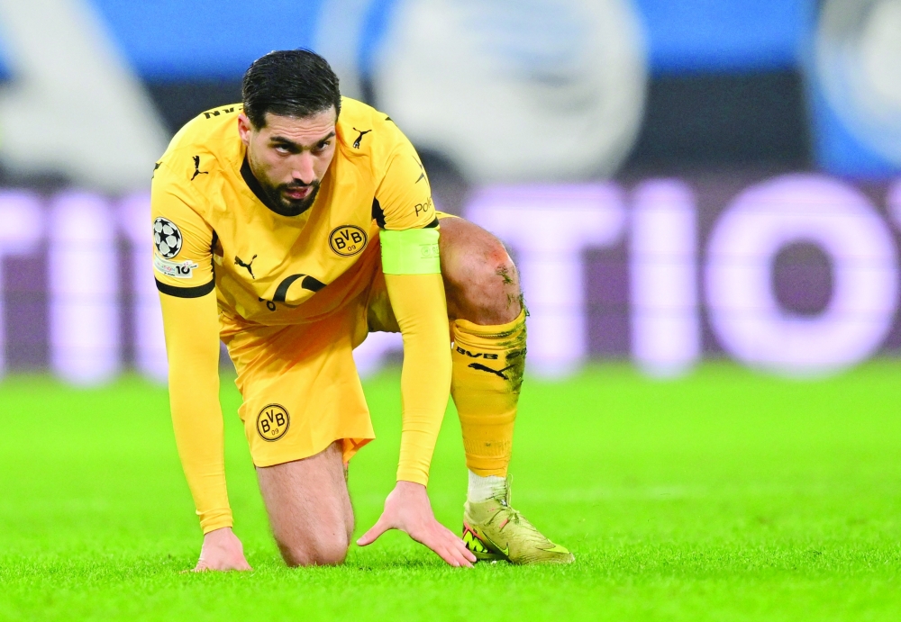 Soccer Football - UEFA Champions League - Play Off - Second Leg - Atalanta v Borussia Dortmund - New Balance Arena, Bergamo, Italy - February 25, 2026 Borussia Dortmund's Emre Can reacts REUTERS/Daniele Mascolo