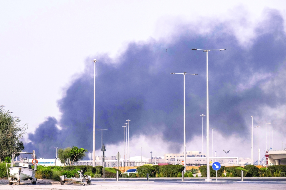 A plume of smoke rises from the Zayed Port following a reported Iranian strike in Abu Dhabi on Sunday. — AFP
