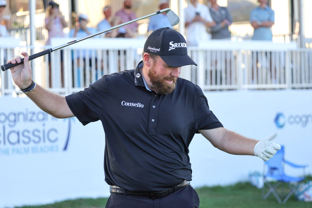  Shane Lowry reacts to hitting the ball in the water on the 17th tee during the final round of the Cognizant Classic golf tournament 